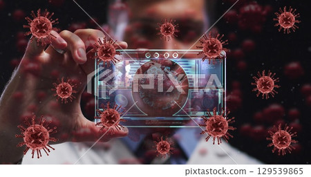 Image of red virus cells over caucasian male doctor with digital card with virus data 129539865