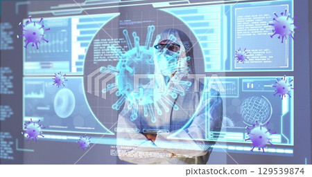 Image of purple virus cells over caucasian male lab worker in safety clothes with digital screen 129539874