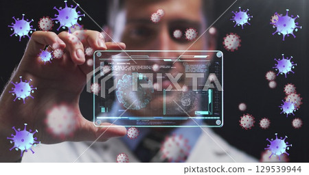 Image of purple virus cells over caucasian male lab worker with digital card with virus data 129539944