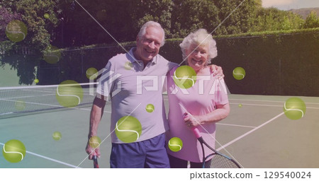 Image of falling tennis ball over caucasian senior couple on the tennis court Image of falling tennis ball over caucasian senior couple on the tennis court 129540024