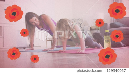 Image of red falling flowers over mother and daughter practicing yoga 129540037