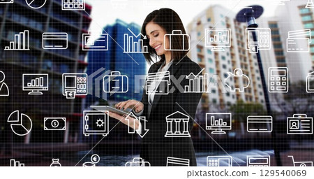 Image of financial icons over caucasian woman with tablet 129540069