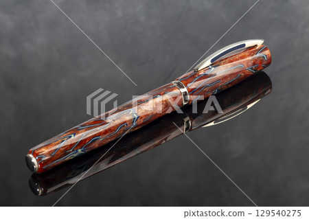 Branded fountain pen on marble gray background. Gift set. Office interior. Branded fountain pen on marble gray background. Gift set. Office interior. 129540275