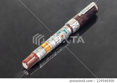 Branded fountain pen on marble gray background. Gift set. Office interior. 129540300