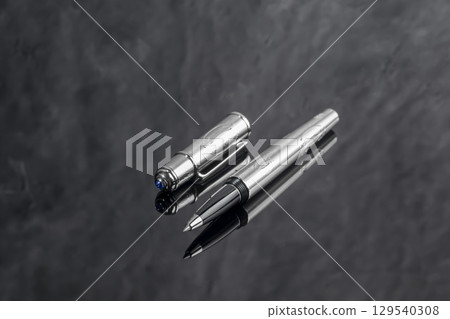 Branded fountain pen on marble gray background. Gift set. Office interior. Branded fountain pen on marble gray background. Gift set. Office interior. 129540308