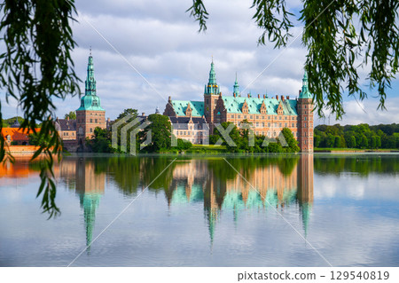 Frederiksborg Castle and its reflection on Lake Pallassee in Hillerød, near Copenhagen, in the Nordic Kingdom of Denmark Frederiksborg Castle and its reflection on Lake Pallassee in Hillerød, near Copenhagen, in the Nordic Kingdom of Denmark 129540819