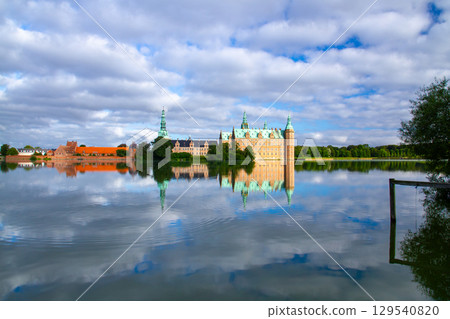 Frederiksborg Castle and its reflection on Lake Pallassee in Hillerød, near Copenhagen, in the Nordic Kingdom of Denmark Frederiksborg Castle and its reflection on Lake Pallassee in Hillerød, near Copenhagen, in the Nordic Kingdom of Denmark 129540820