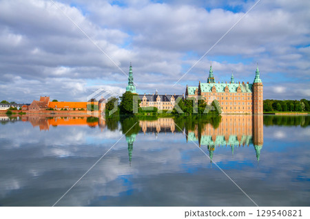 Frederiksborg Castle and its reflection on Lake Pallassee in Hillerød, near Copenhagen, in the Nordic Kingdom of Denmark Frederiksborg Castle and its reflection on Lake Pallassee in Hillerød, near Copenhagen, in the Nordic Kingdom of Denmark 129540821