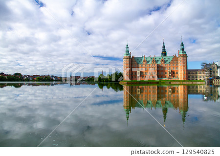 Frederiksborg Castle and its reflection on Lake Pallassee in Hillerød, near Copenhagen, in the Nordic Kingdom of Denmark Frederiksborg Castle and its reflection on Lake Pallassee in Hillerød, near Copenhagen, in the Nordic Kingdom of Denmark 129540825