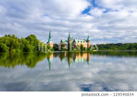 Frederiksborg Castle and its reflection on Lake Pallassee in Hillerød, near Copenhagen, in the Nordic Kingdom of Denmark 129540834