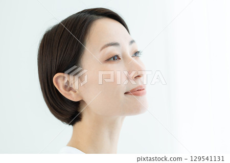 A woman with a clear complexion looking ahead, close-up of her beautiful skin A woman with a clear complexion looking ahead, close-up of her beautiful skin 129541131