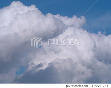 White clouds floating in the blue summer sky 129541251