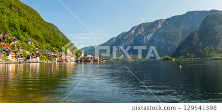 Hallstatt on Lake Hallstatt, a beautiful historic small town on the shore of a lake by mountains, Austria 129541398
