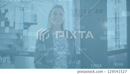 Image of data processing over caucasian businesswoman using smartphone in office 129541527