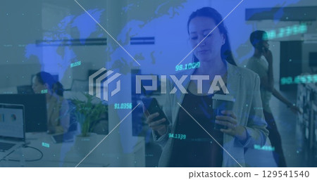 Image of data processing over asian businesswoman using smartphone in office Image of data processing over asian businesswoman using smartphone in office 129541540