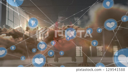 Image of network of connections and sky with clouds over african american man exercising 129541588