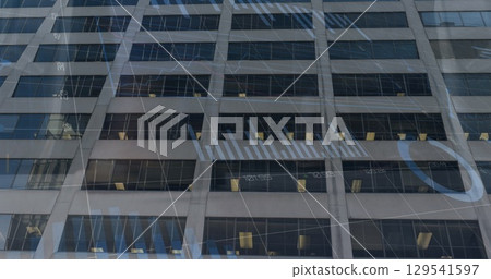 Image of financial graphs and data over office building 129541597