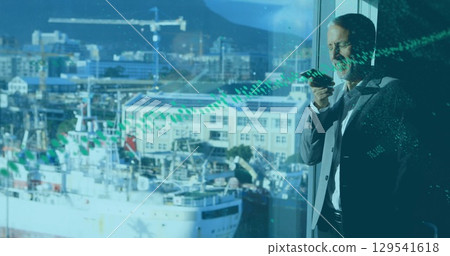 Image of data processing over caucasian businessman talking on smartphone 129541618