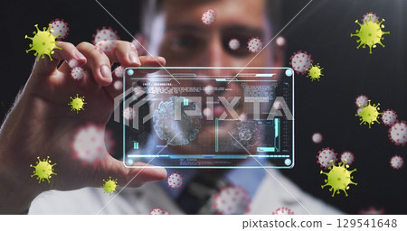 Image of virus yellow cells over caucasian male doctor with digital card with virus data 129541648