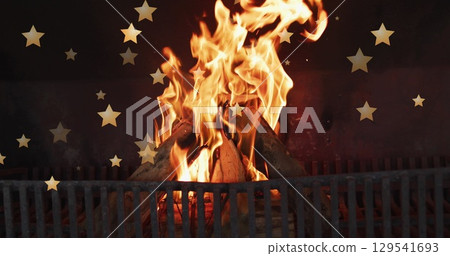Image of stars over flames in fireplace 129541693