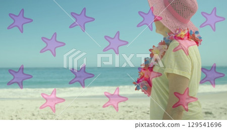 Image of falling stars over caucasian senior women Image of falling stars over caucasian senior women 129541696