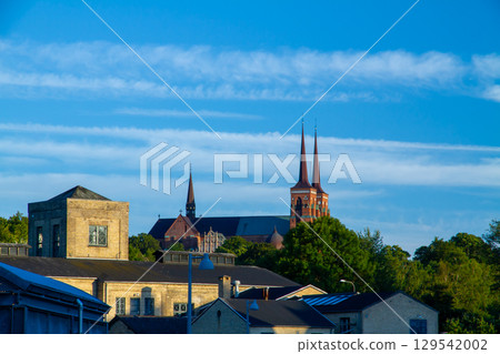 Distant view of Roskilde Cathedral, a Gothic World Heritage Site in the city of Roskilde near Copenhagen in the Kingdom of Denmark in Northern Europe 129542002