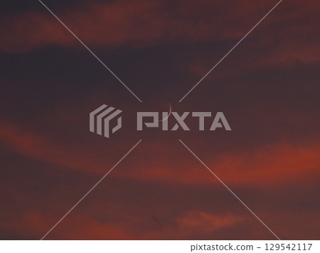 Bright red sunset clouds Bright red sunset clouds 129542117