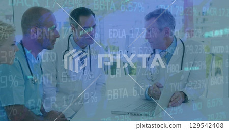 Image of data processing over group of diverse doctors Image of data processing over group of diverse doctors 129542408