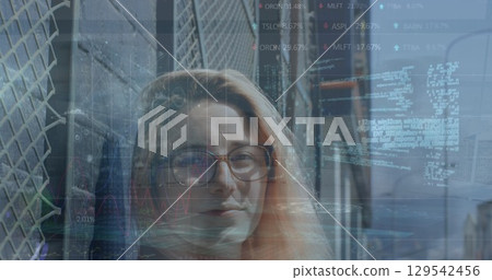Image of financial data processing over businesswoman in office Image of financial data processing over businesswoman in office 129542456