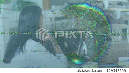 Image of data processing and globe over businesswoman using laptop 129542539