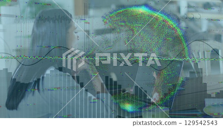 Image of graphs and globe over woman having image call on laptop 129542543