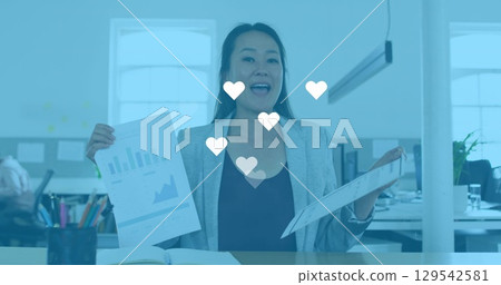 Image of social media icon and changing numbers over woman wearing phone headset Image of social media icon and changing numbers over woman wearing phone headset 129542581