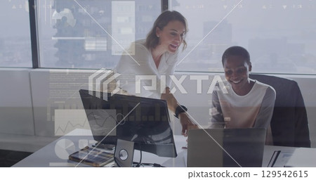 Image of online using laptop and bitcoin icons over woman using laptop 129542615