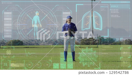Image of data processing over caucasian female baseball player Image of data processing over caucasian female baseball player 129542786