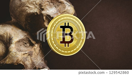 Image of skull and bitcoin over black background Image of skull and bitcoin over black background 129542860