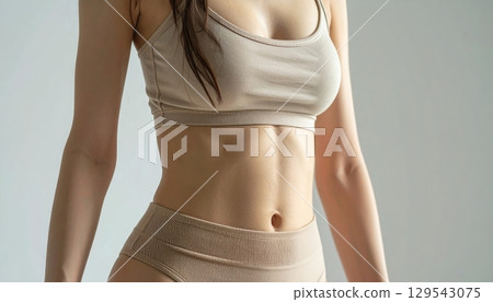 Young woman exercising 129543075