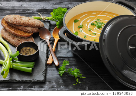 roasted parsnip and carrot soup, top view 129543083