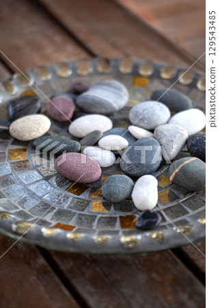 Mineral decoration on a wooden table Mineral decoration on a wooden table 129543485