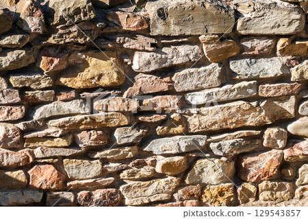 Backgrounds of the old stone wall. 129543857
