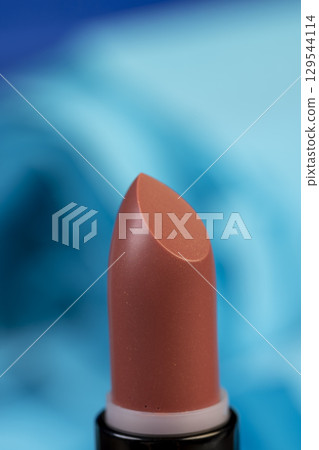 new lipstick for makeup, new dull red women's lipstick for lips, closeup new lipstick for makeup, new dull red women's lipstick for lips, closeup 129544114