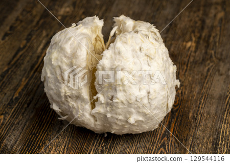 pistachios crushed into pieces of different sizes, a bunch of green pistachios 129544116