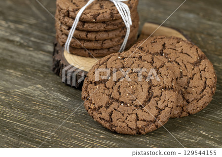 brown cookies with chocolate flavor, chocolate biscuits with cocoa and sesame 129544155