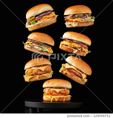 Floating Hamburger Tower on black background Floating Hamburger Tower on black background 129544752
