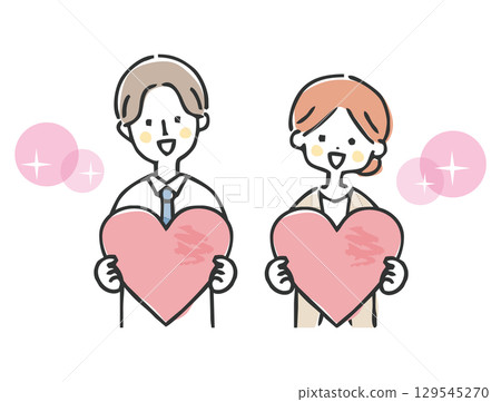 Businessman and businesswoman holding a heart 129545270