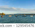 Anchored boats along the shoreline in Allensbach, Lake Constance, Baden-Wuerttemberg, Germany 129545476