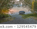 Covered rowboat on the shore of Reichenau Island, Lake Constance, Baden-Wuerttemberg, Germany 129545479