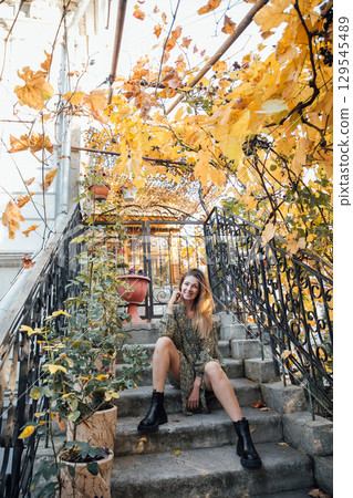 woman in autumn clothes smiling woman in autumn clothes smiling 129545489