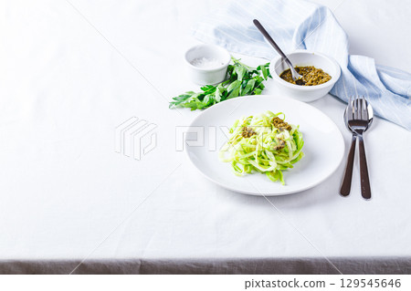 Healthy Zucchini Noddles with pesto 129545646
