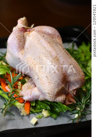 Roast chicken cooking preparation 129545921