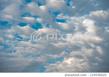 Blue sky with scattered white cumulus clouds. Blue sky with scattered white cumulus clouds. 129546020